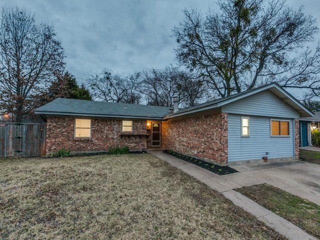 ranch-style house with a front lawn