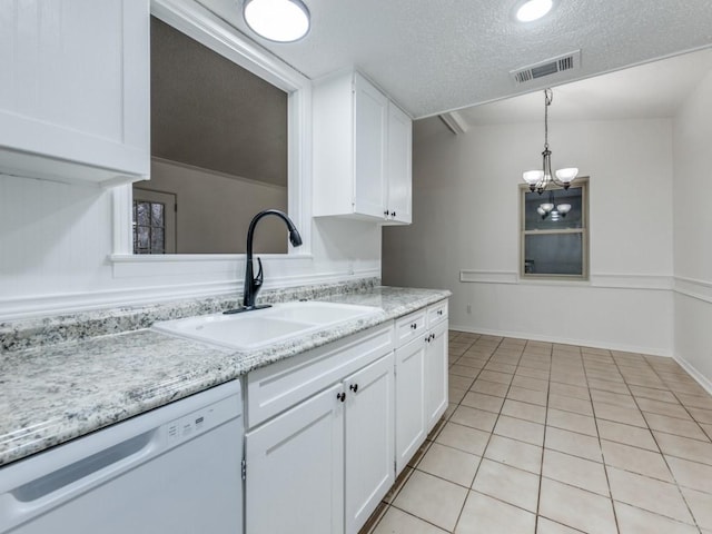 kitchen with dishwasher, sink, white cabinets, hanging light fixtures, and light tile patterned floors