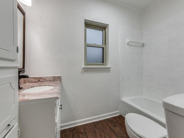 full bathroom with hardwood / wood-style flooring, vanity, toilet, and shower / bathing tub combination