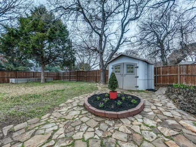 view of yard with a patio area and a storage unit