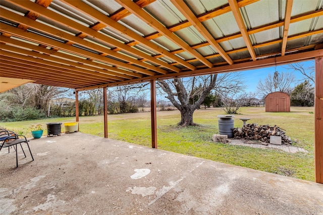 view of patio / terrace featuring a storage unit