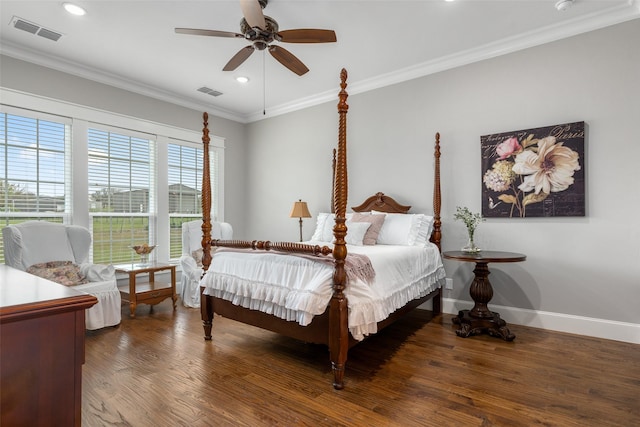 bedroom with dark hardwood / wood-style flooring, ornamental molding, and ceiling fan