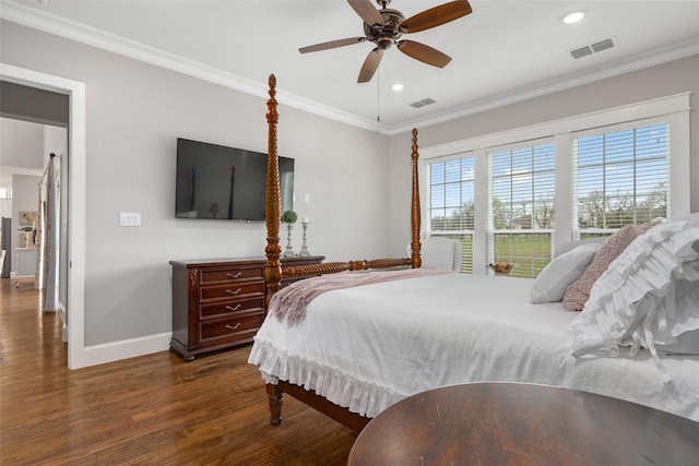 bedroom featuring ornamental molding, dark hardwood / wood-style flooring, and ceiling fan