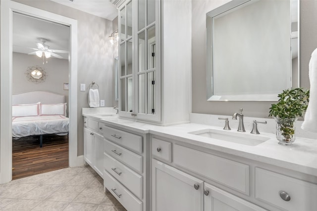 bathroom featuring vanity, tile patterned flooring, and ceiling fan