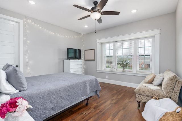 bedroom featuring dark hardwood / wood-style flooring and ceiling fan