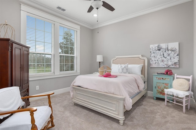 bedroom featuring crown molding, ceiling fan, and light carpet