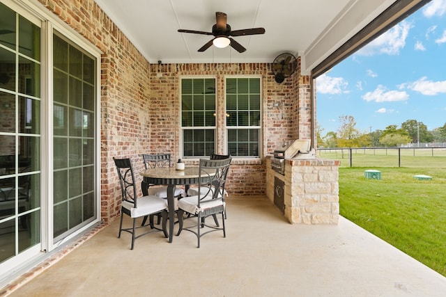 view of patio / terrace featuring an outdoor kitchen, a grill, and ceiling fan