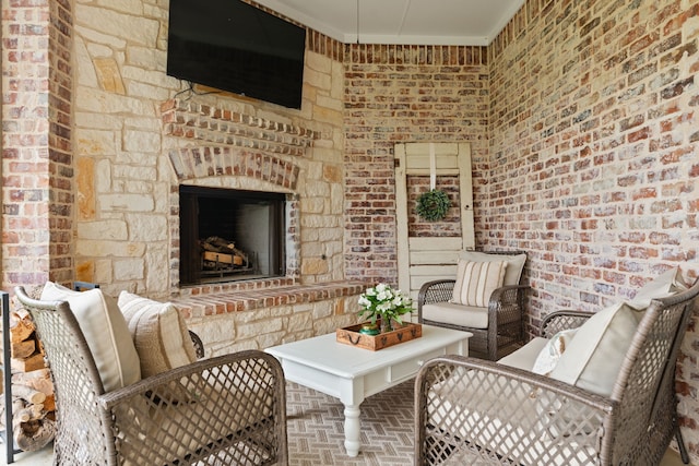 view of patio / terrace featuring an outdoor stone fireplace