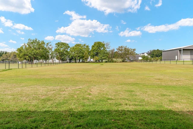 view of yard with a rural view