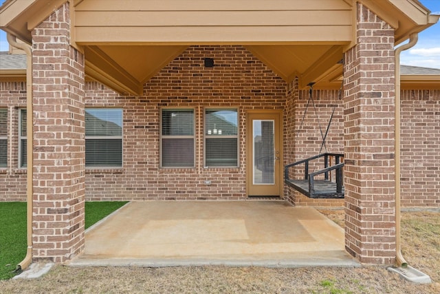 property entrance with a patio area