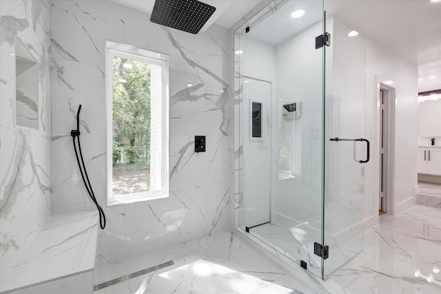 bathroom with a wealth of natural light and walk in shower