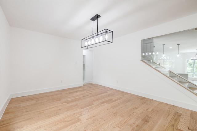 unfurnished dining area with light hardwood / wood-style flooring