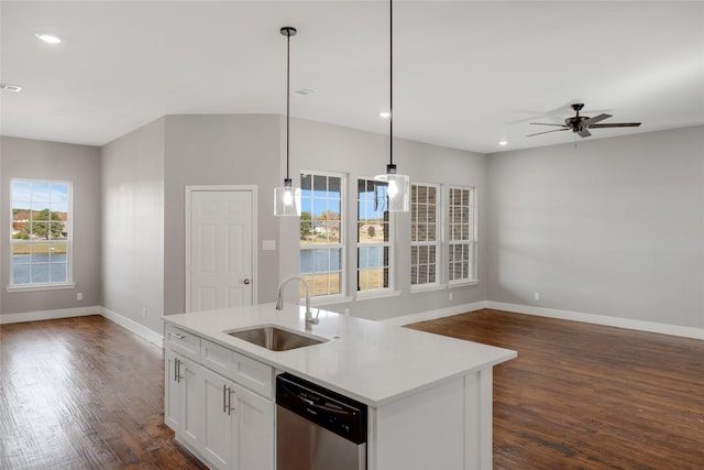 kitchen featuring sink, pendant lighting, white cabinets, and stainless steel appliances