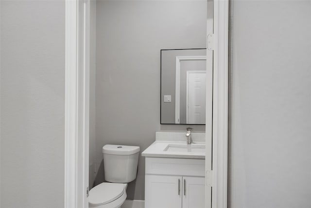 bathroom with toilet and vanity