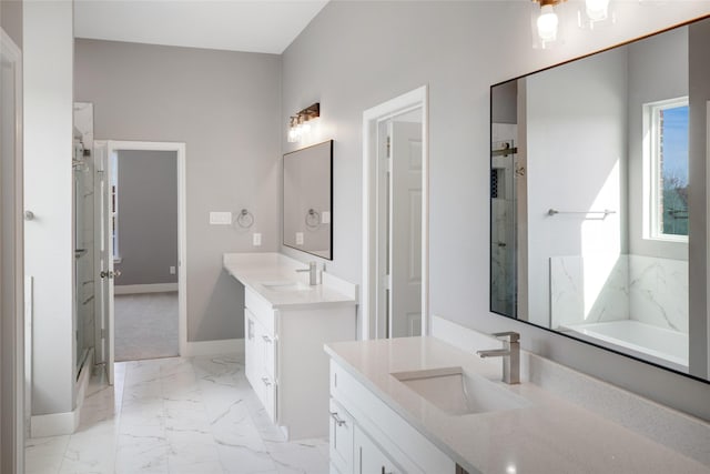 bathroom featuring a healthy amount of sunlight, separate shower and tub, and vanity