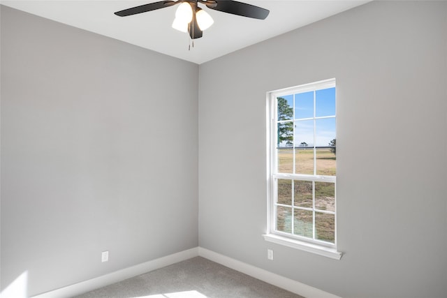 spare room with ceiling fan and carpet flooring