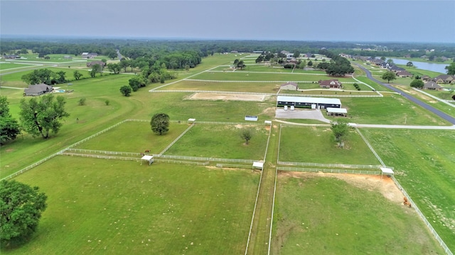 drone / aerial view featuring a water view and a rural view