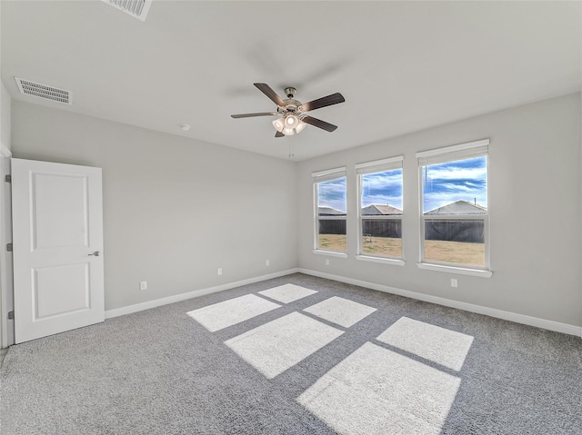 carpeted empty room with ceiling fan