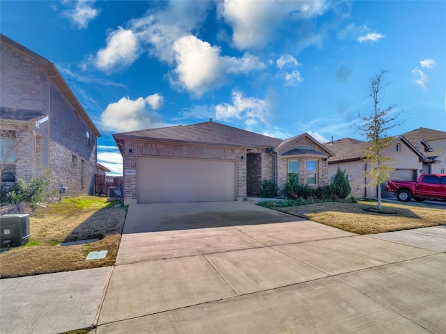 ranch-style home featuring a garage and a front lawn