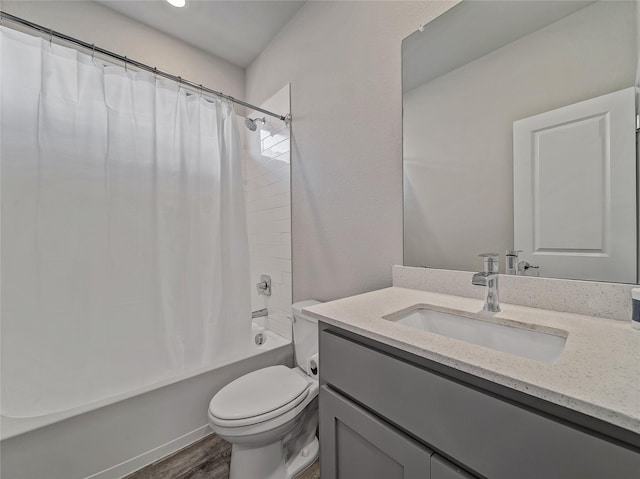 full bathroom featuring vanity, shower / tub combo, hardwood / wood-style flooring, and toilet