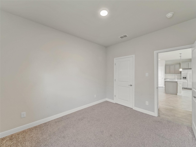 view of carpeted spare room