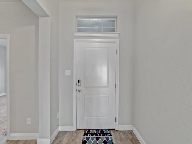 entryway with light hardwood / wood-style flooring