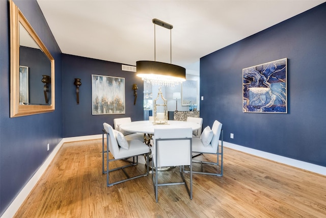 dining space with light wood-type flooring