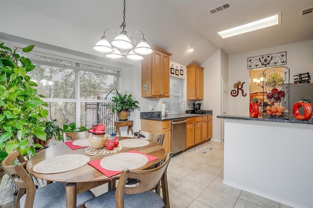 tiled dining room with sink, a chandelier, and lofted ceiling