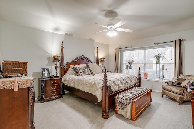 bedroom featuring ceiling fan and light carpet