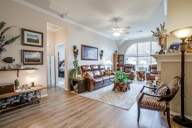 living room featuring ornamental molding, ceiling fan, and light hardwood / wood-style flooring