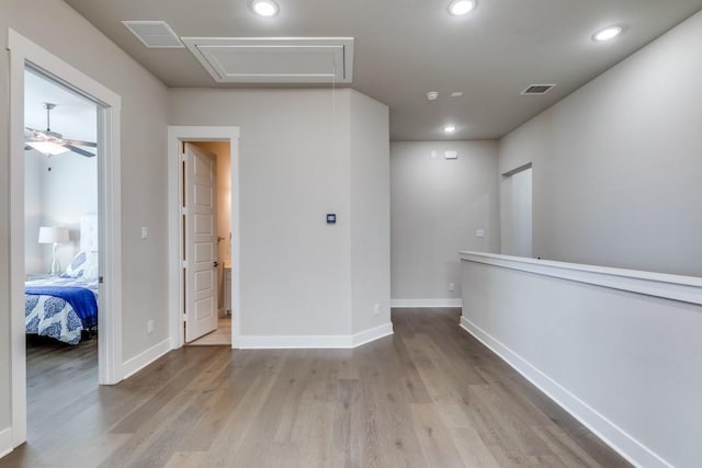 unfurnished room featuring light hardwood / wood-style floors and ceiling fan