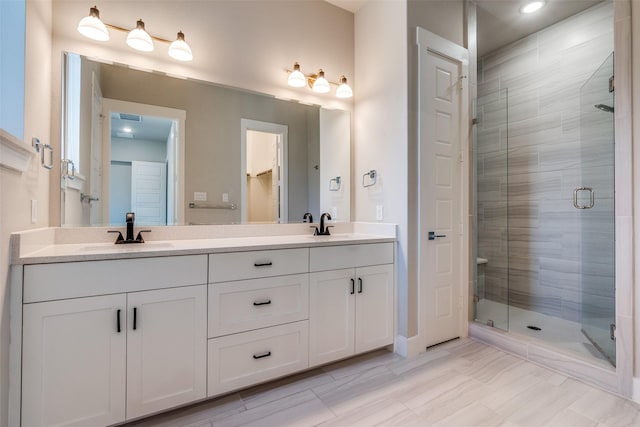 7836 Minglewood Ln, Dallas, TX 75231 - full bath with a shower stall, double vanity, recessed lighting, and baseboards