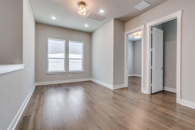 7836 Minglewood Ln, Dallas, TX 75231 - spare room with wood finished floors, baseboards, and recessed lighting