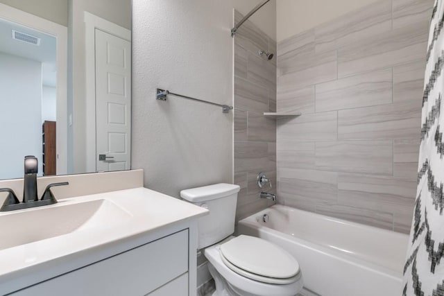 full bathroom featuring vanity, toilet, and shower / bath combo with shower curtain