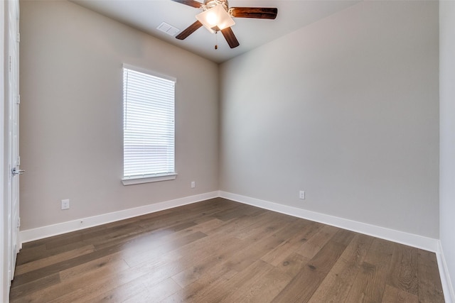 7836 Minglewood Ln, Dallas, TX 75231 - empty room with dark wood-style flooring, ceiling fan, and baseboards