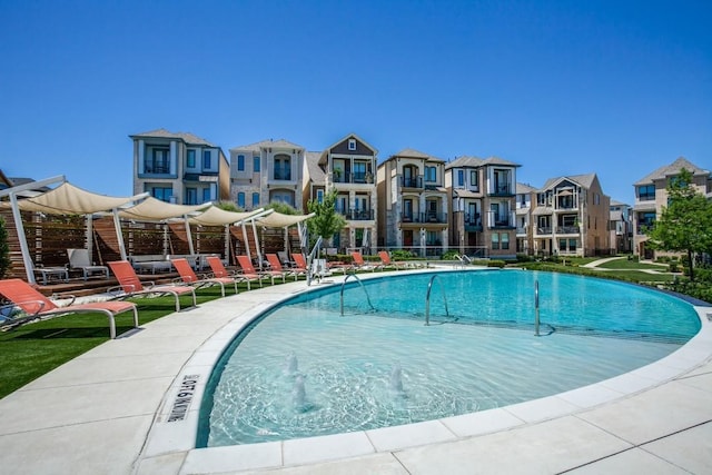 view of swimming pool with a patio area