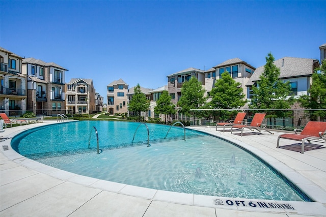 7836 Minglewood Ln, Dallas, TX 75231 - community pool featuring a residential view, fence, and a patio area