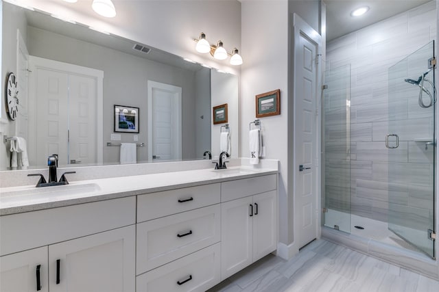 7836 Minglewood Ln, Dallas, TX 75231 - bathroom with a shower stall, double vanity, marble finish floors, and recessed lighting