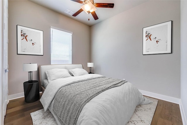 7836 Minglewood Ln, Dallas, TX 75231 - bedroom with baseboards, wood finished floors, and a ceiling fan