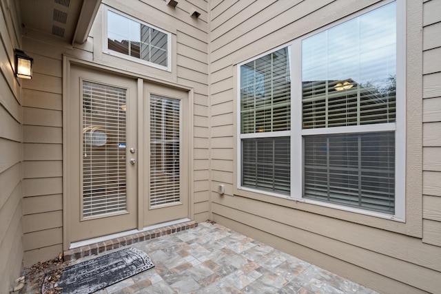 doorway to property featuring a patio area