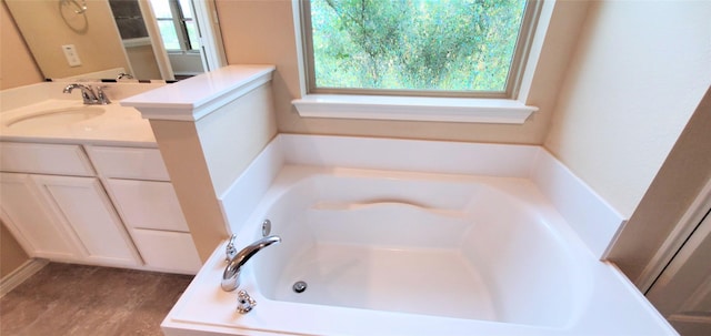 bathroom featuring a tub and vanity