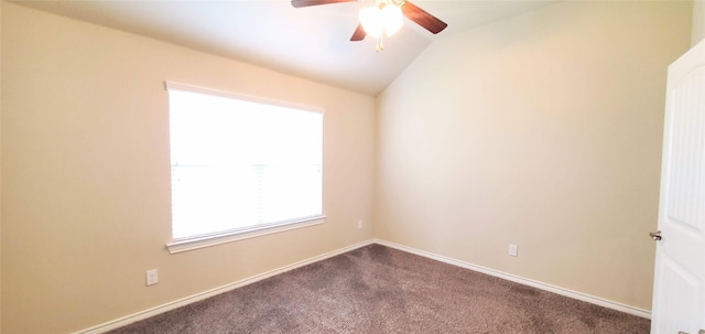 carpeted empty room with ceiling fan and lofted ceiling