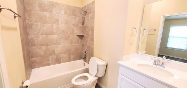 full bathroom with vanity, toilet, and tiled shower / bath