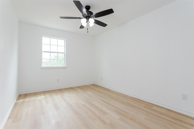 spare room with ceiling fan and light hardwood / wood-style flooring