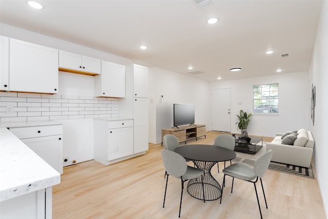 dining room with light wood-type flooring