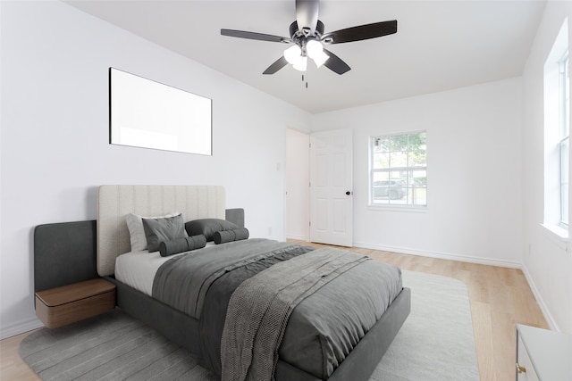 bedroom featuring ceiling fan and light wood-type flooring