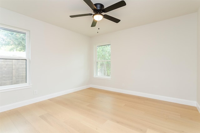 unfurnished room featuring ceiling fan, a healthy amount of sunlight, and light hardwood / wood-style floors