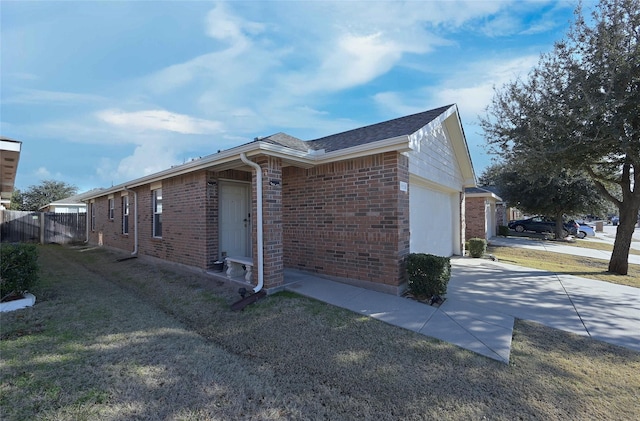 view of side of home featuring a garage