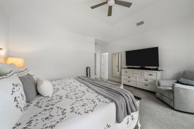 bedroom with vaulted ceiling, light colored carpet, and ceiling fan