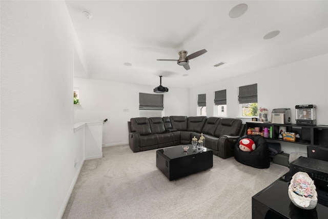 carpeted living room featuring ceiling fan